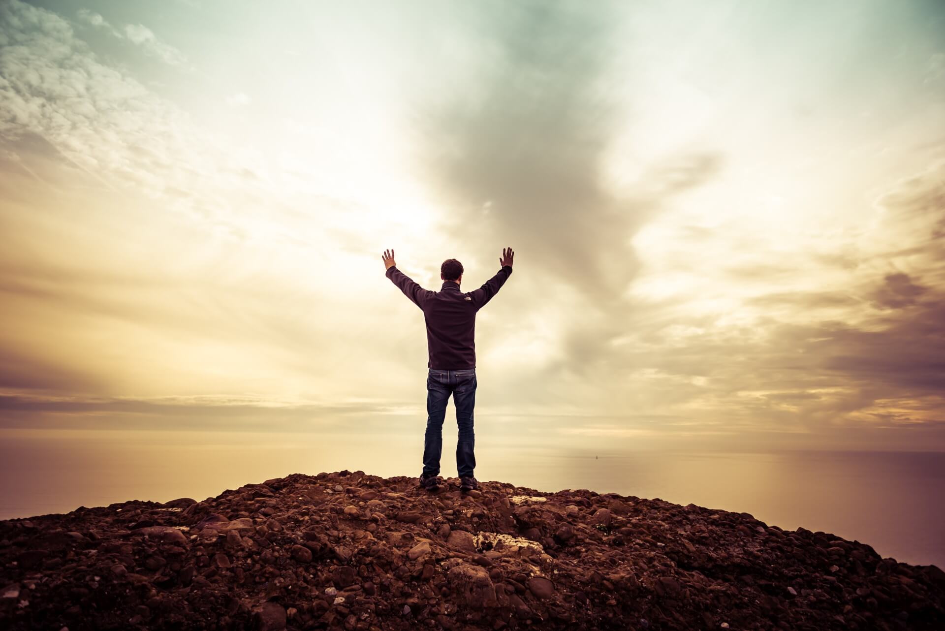 Man standing on top of mountain